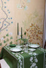 rectangular green embroidered tablecloth with white flowers in dining room