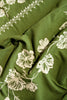 rectangular green embroidered tablecloth with white flowers, flower detail