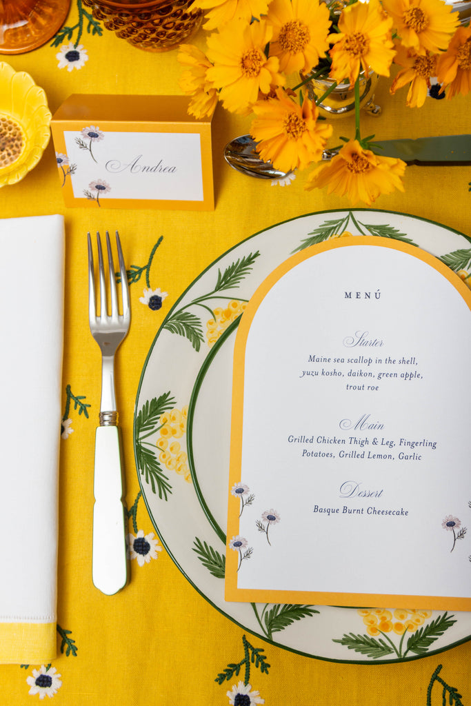 rectangular yellow tablecloth with white daisies with menu