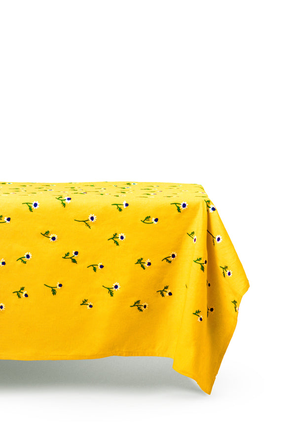 rectangular yellow tablecloth with white daisies side view