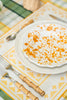 rectangular ivory and yellow embroidered placemat with splatterware