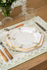 rectangular ivory and green embroidered placemat with floral plates