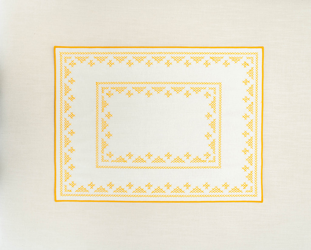 rectangular ivory and yellow embroidered placemat 