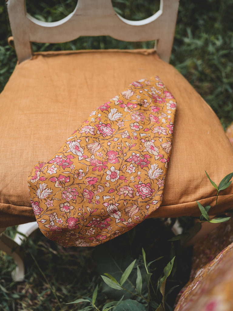 floral linen napkins in gold daphne pattern folded