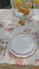 video of tablescape using linen tablecloth with red climbing rose pattern
