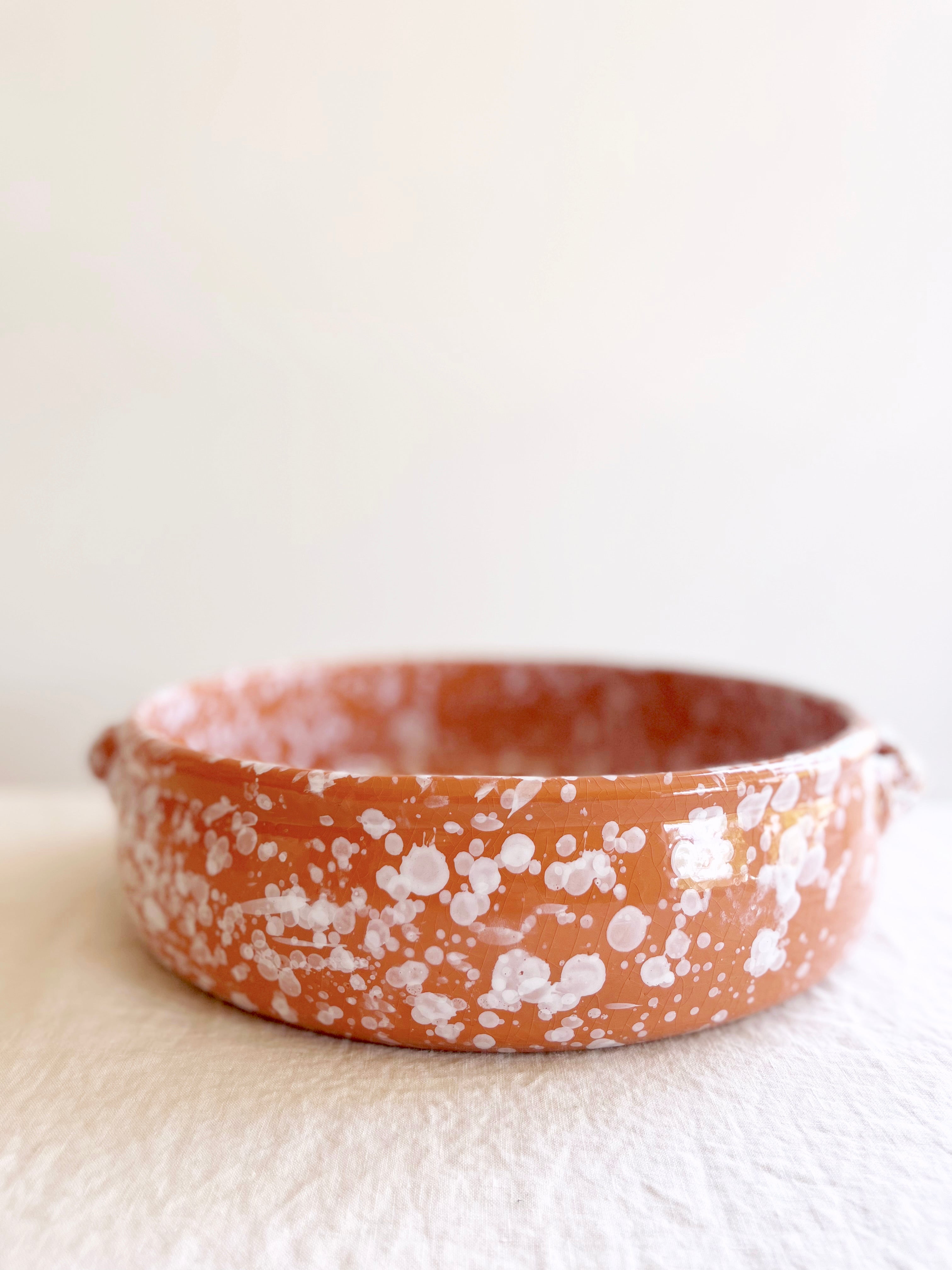 brown round oven safe dish with white speckle pattern speckle pattern 12.5" diameter