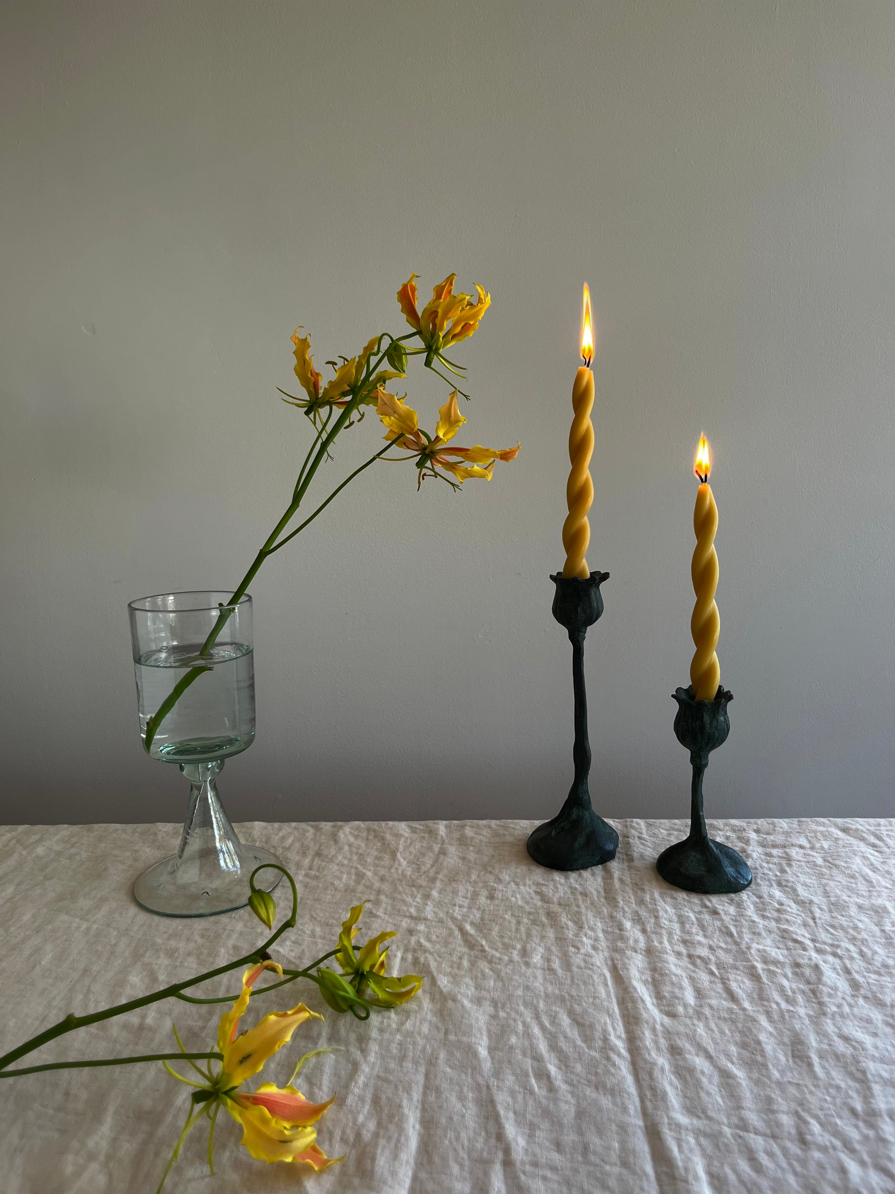 poppy pods taper candle holder 5.5 inch on white table