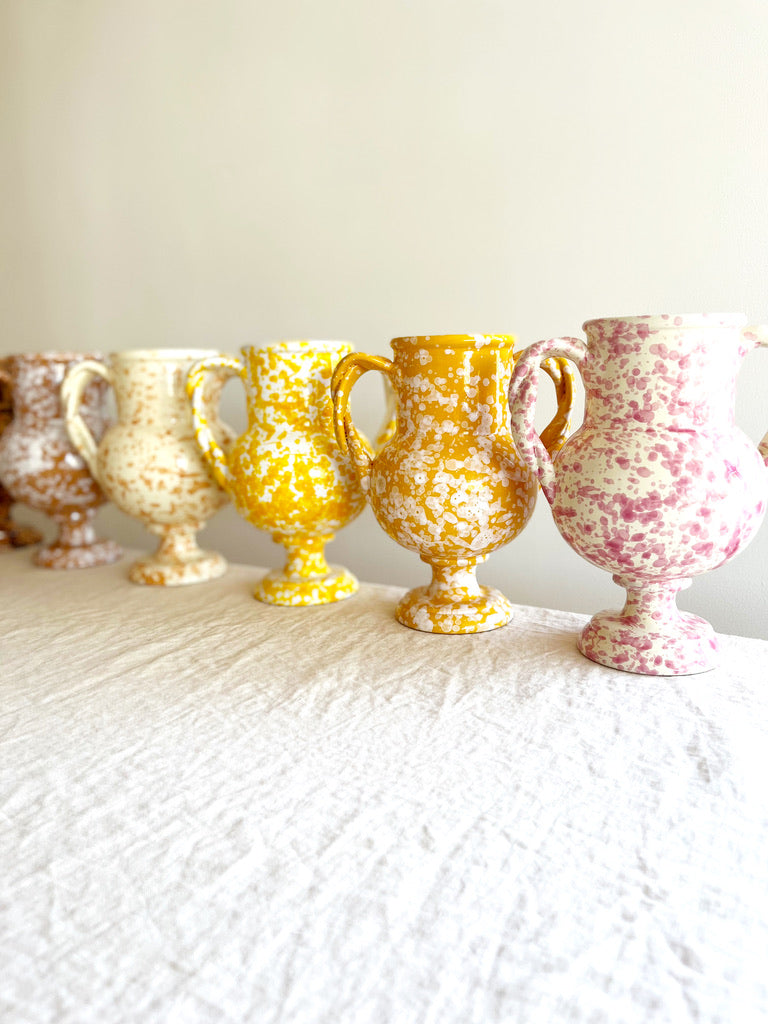 small white amphora vase with pink speckle pattern 8.25 inches tall in group of 5