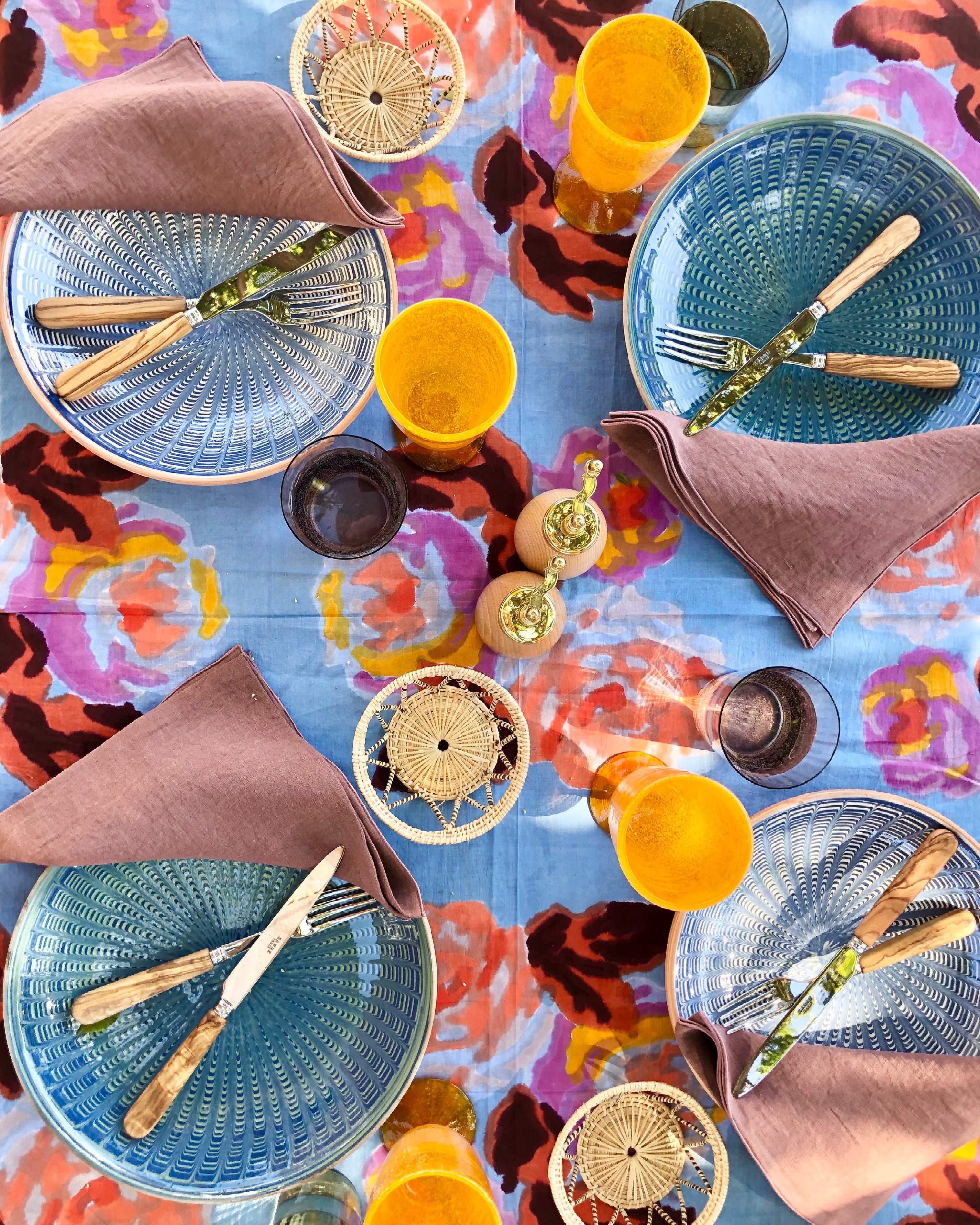 teal and green dinner plate with radial peacock pattern in tablescape