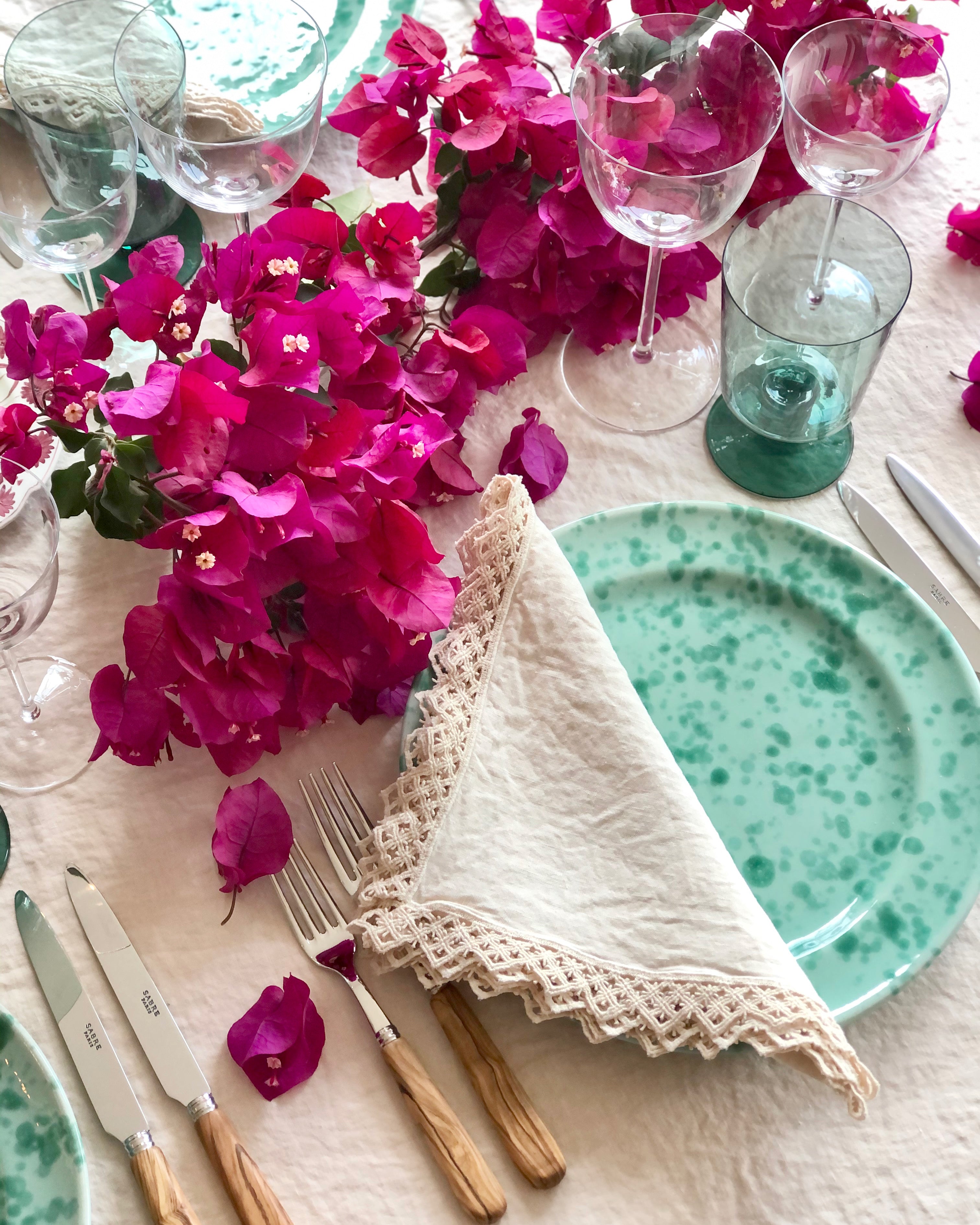 cream linen napkins with macrame trim with placesetting