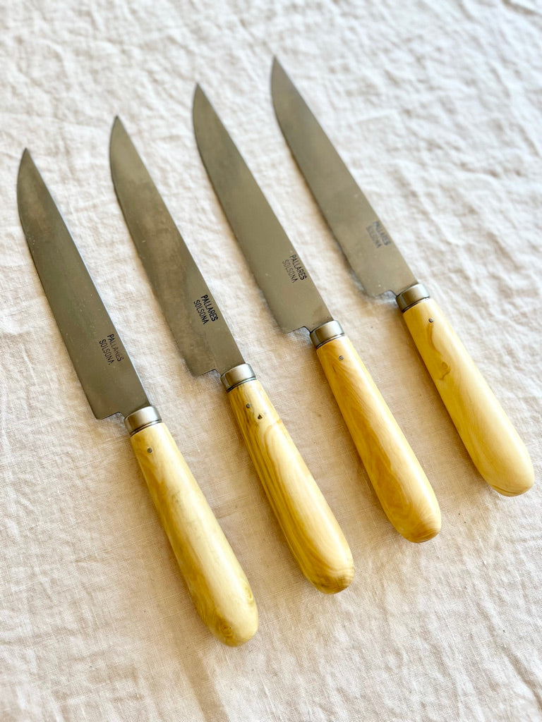 kitchen knife with boxwood handle by pallares solsona carbon steel 15cm four on table