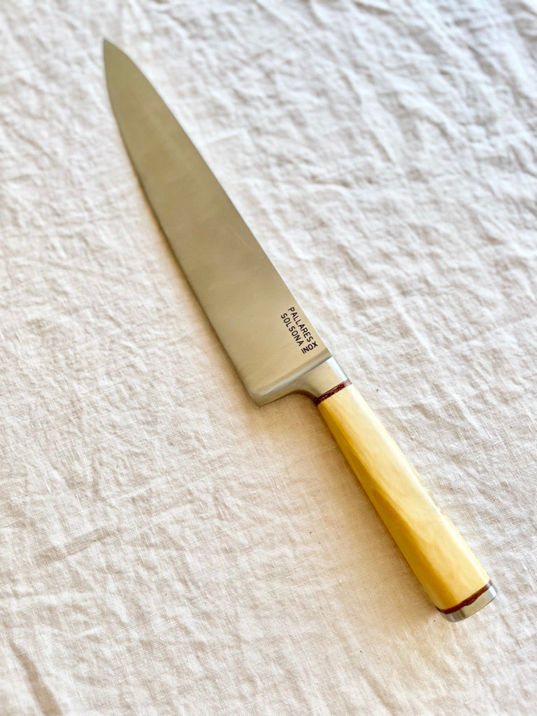 chef knife with boxwood handle diagonally on white table by pallares solsona 22.5cm