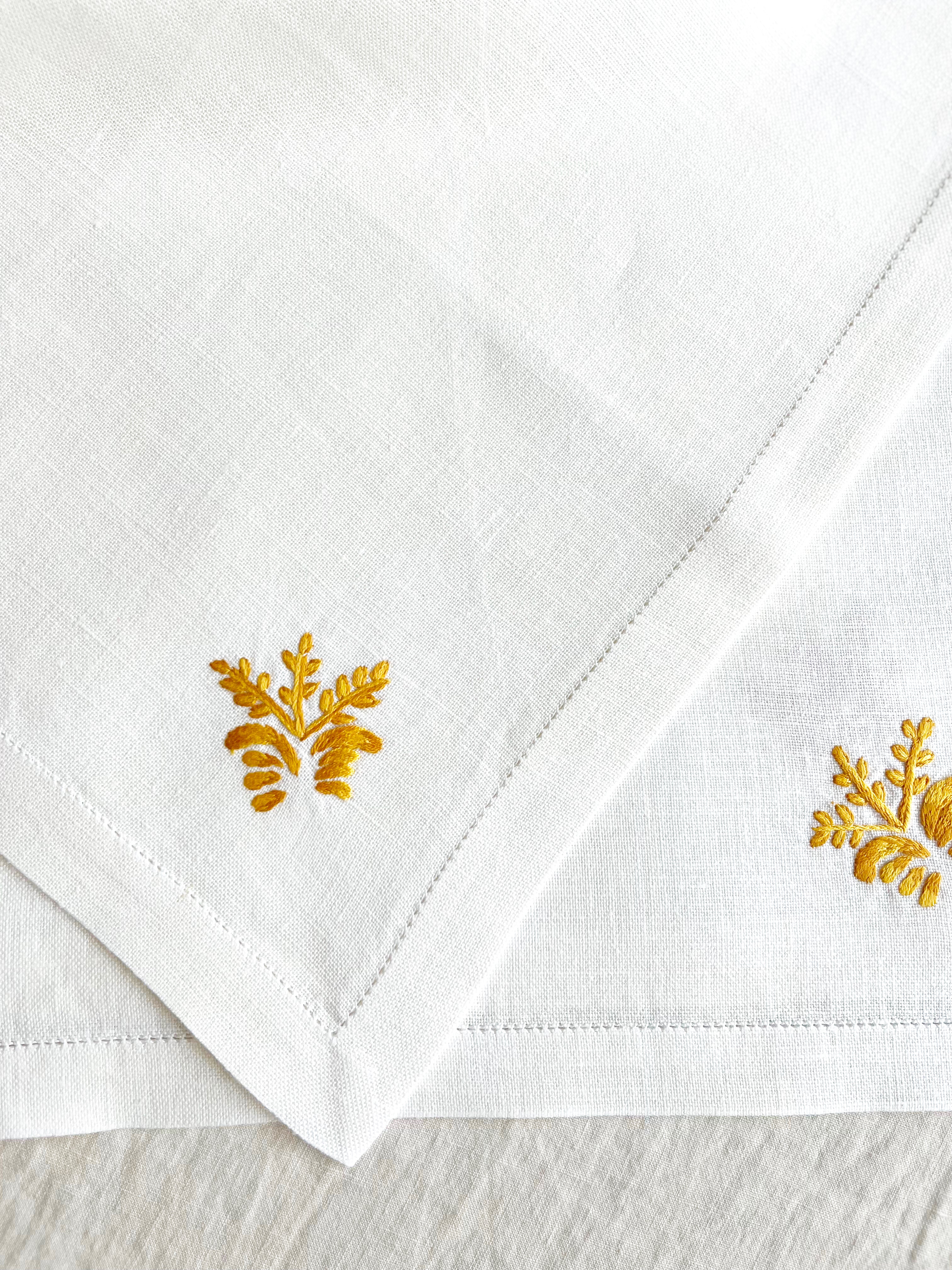 white hand embroidered linen napkins with gold corn stalk in corner 16 inches square detail view