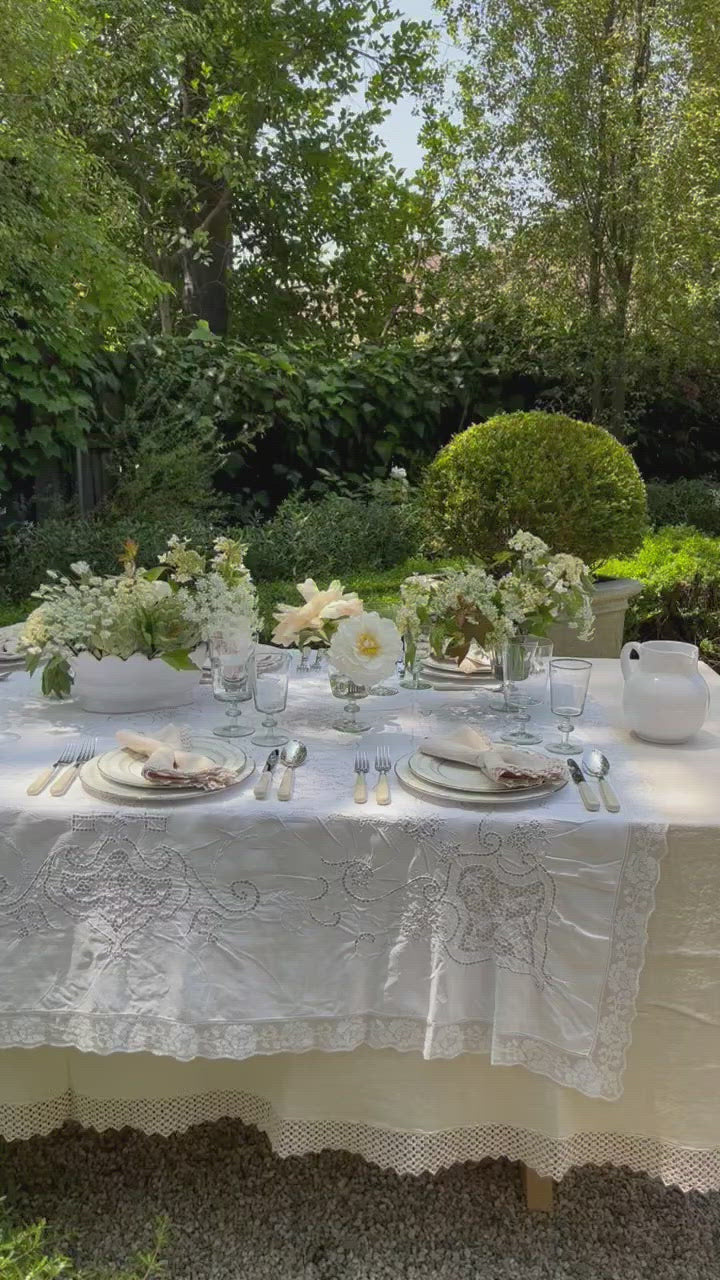 video of cream linen tablecloth with macrame trim