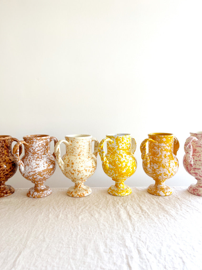 small brown amphora vase with white speckle pattern 8.25 inches tall shown with other color options