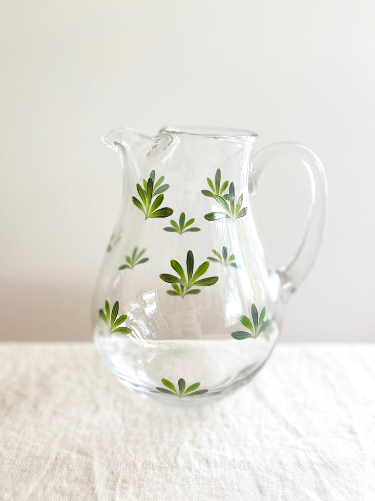 glass pitcher with dark green leaf pattern