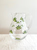 glass pitcher with dark green leaf pattern