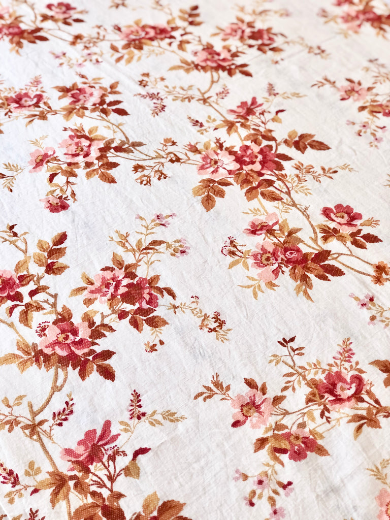linen tablecloth with red climbing rose pattern flower detail
