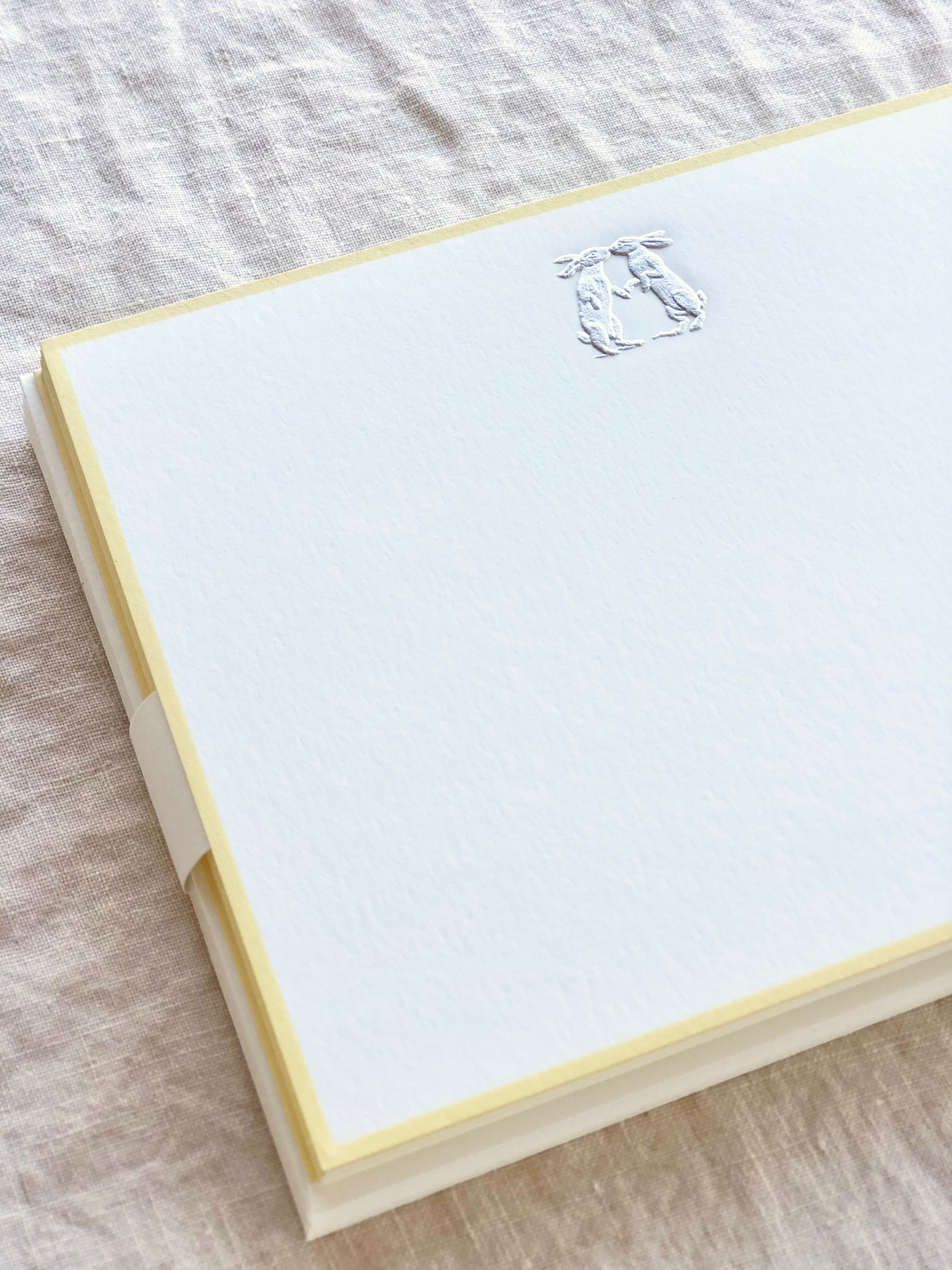 The Printery Bunny Kisses Stationary white with silver bunnies and yellow edge 6.25 by 4.5 inches detail view