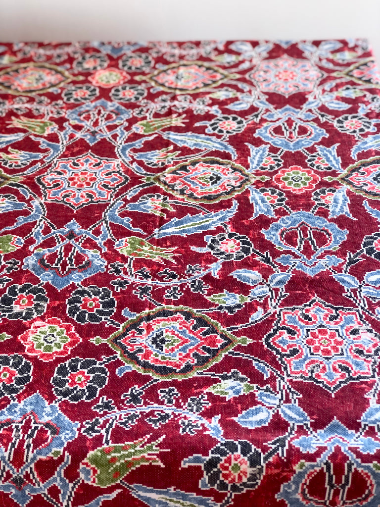 red linen tablecloth with navy, dusty blue and light red floral pattern alternate view