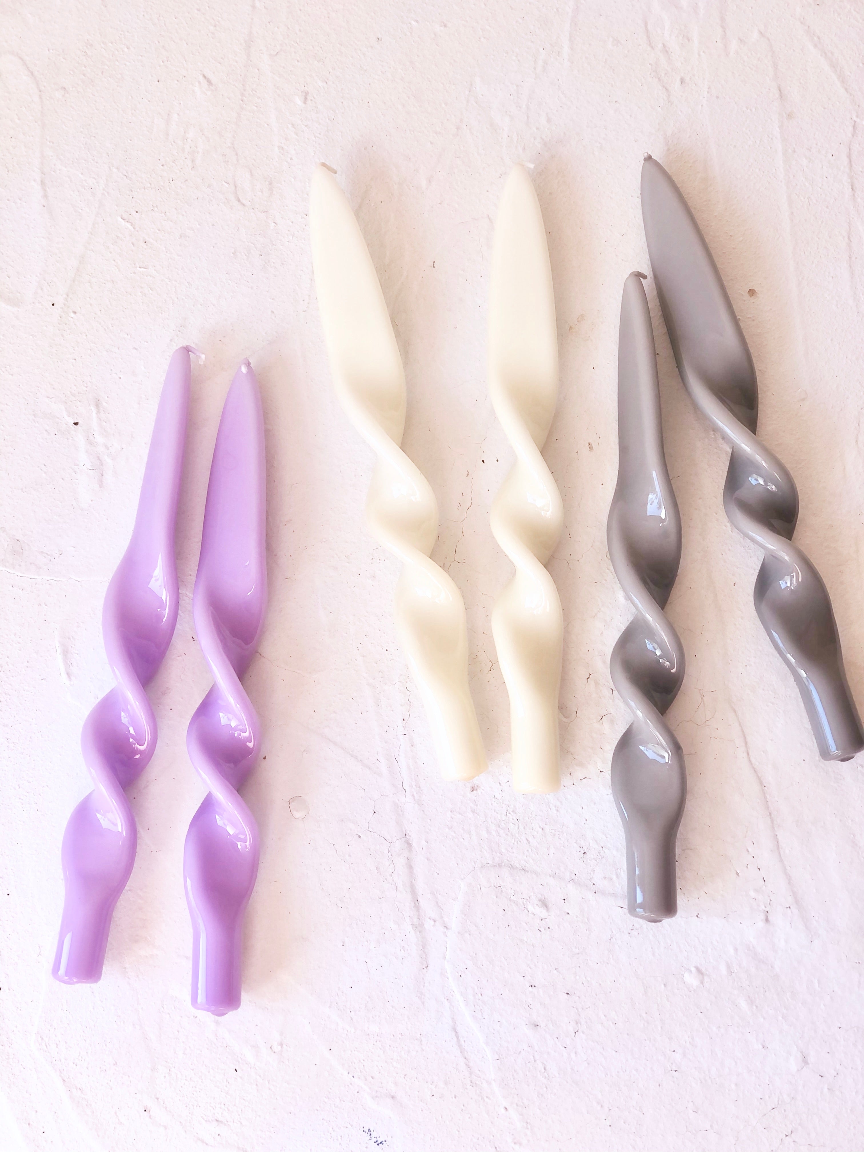 lavender twisted taper candles 11 inches tall shown in lavender cream and gray colors