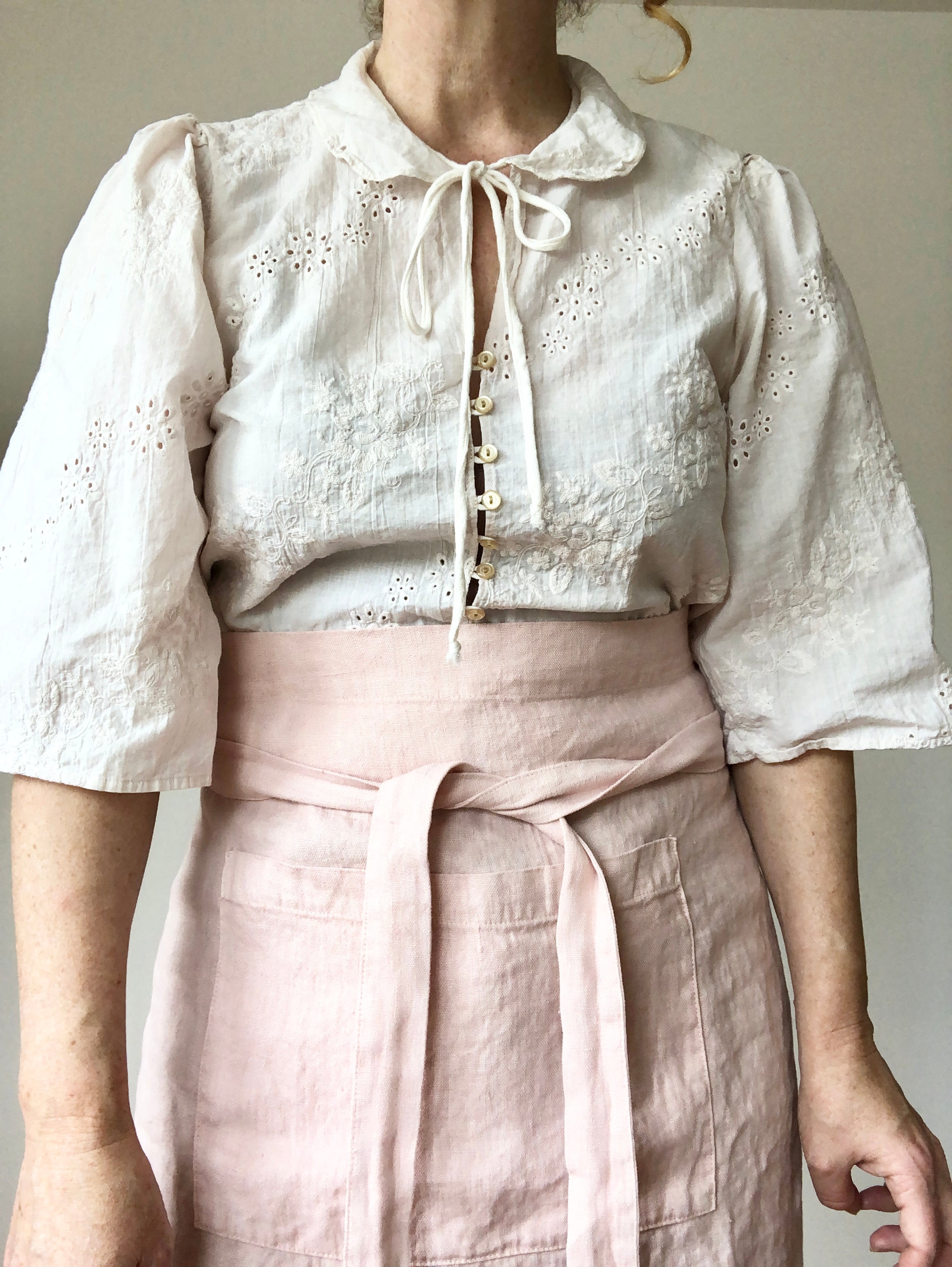 light pink linen apron bistro style waist detail view