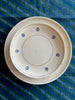 hand painted salad plate with brown rim and blue flowers around edge on blue tablecloth