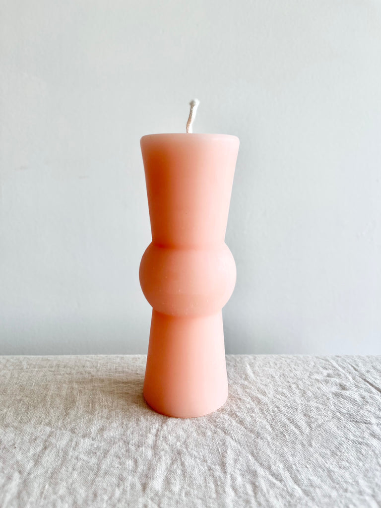 light pink peony totem candle medium size on table