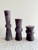 small colored totem candles in large medium and small sizes