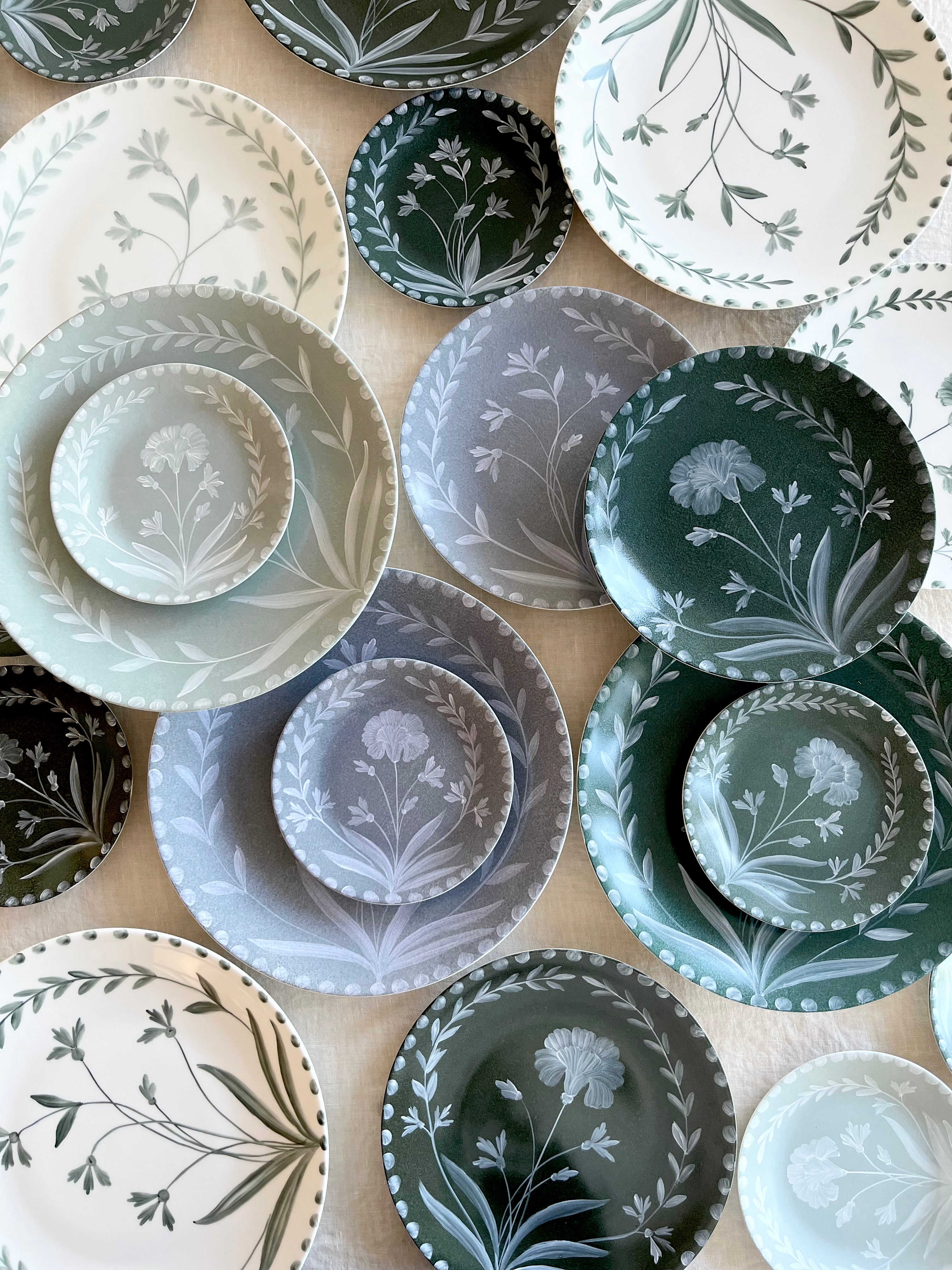 blue dinner plate with white floral pattern in group with other color options