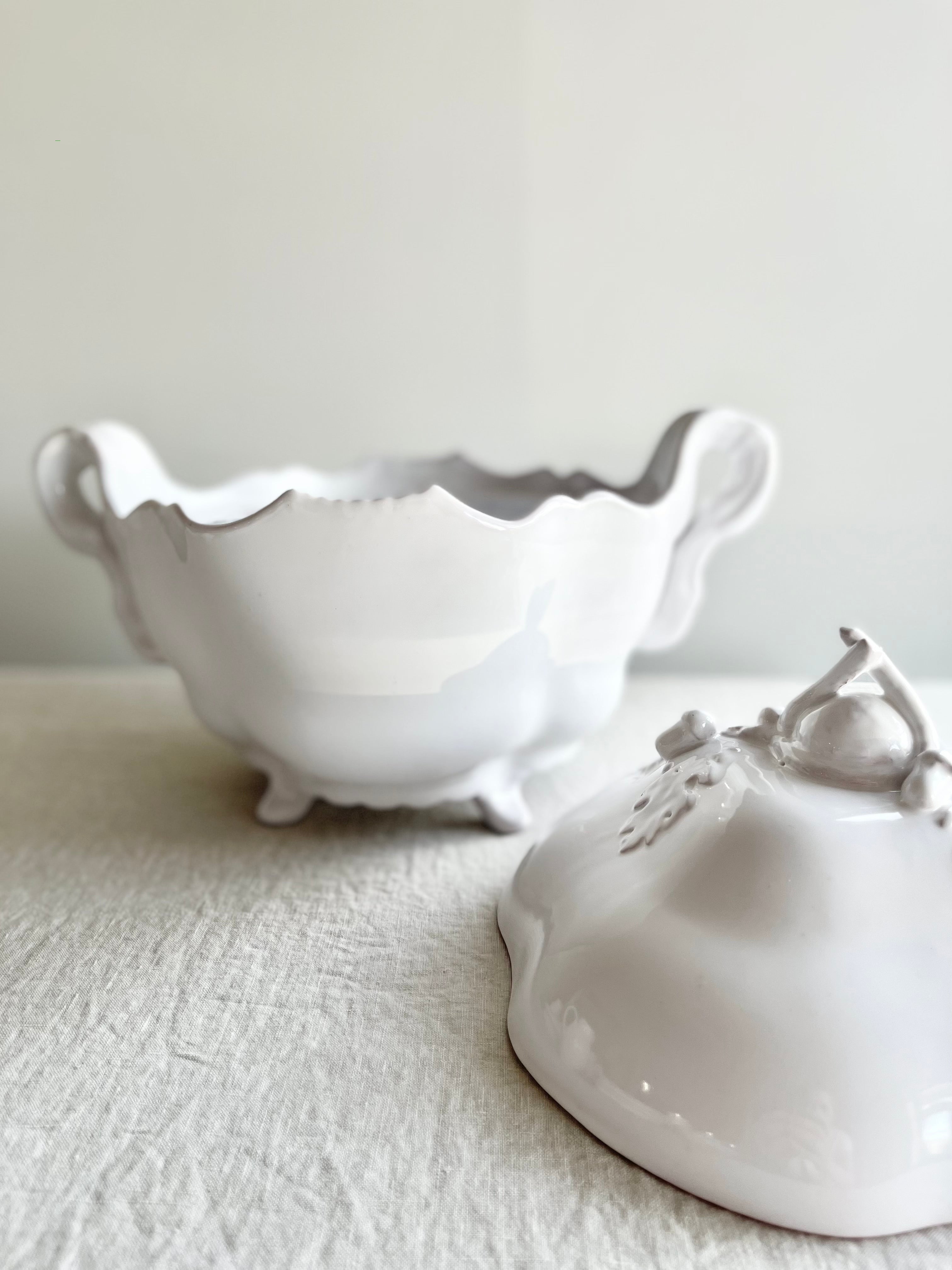 white soup tureen oak antique style bowl and lid displayed on table