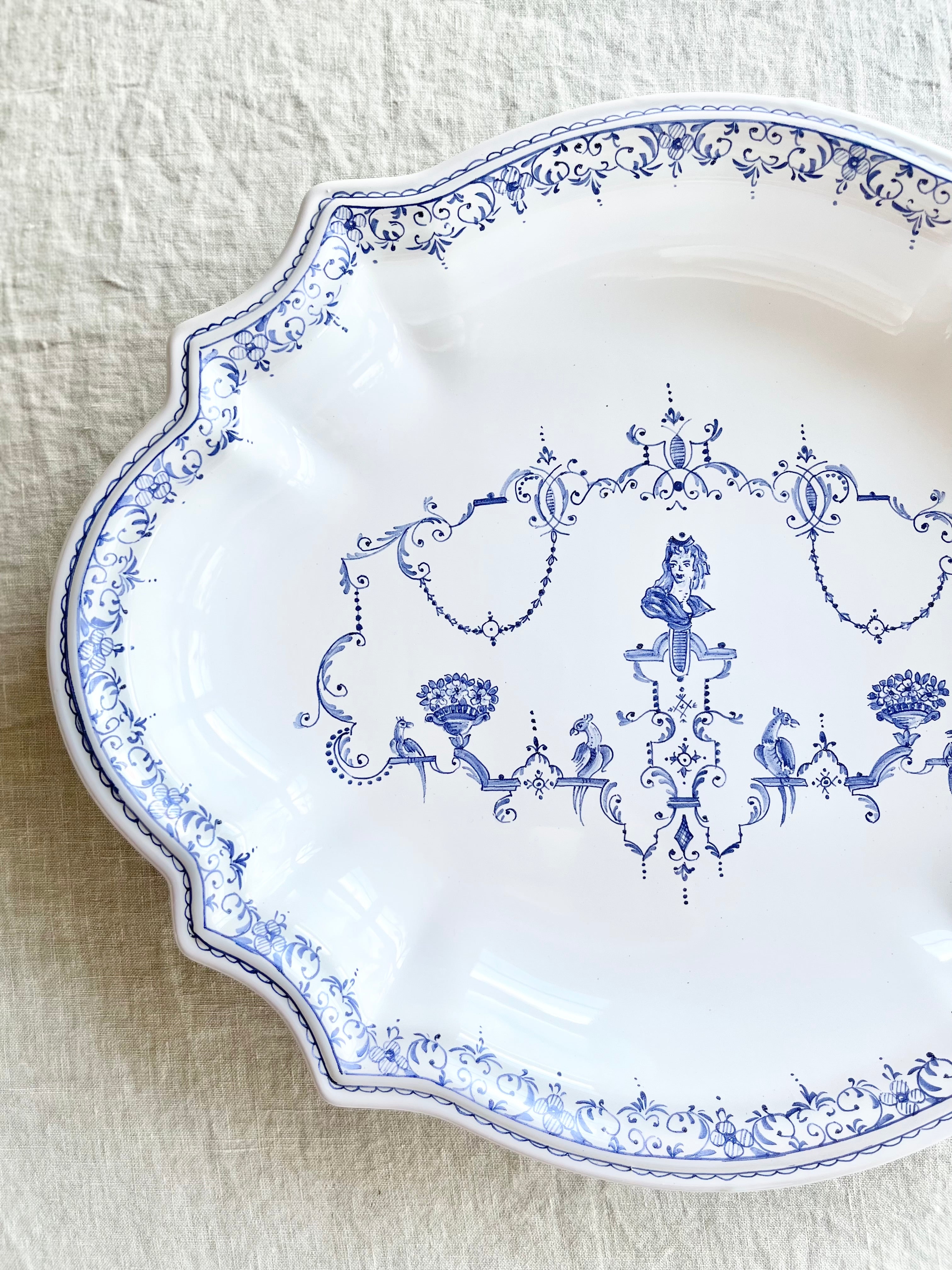hand painted faience blue and white platter detail view