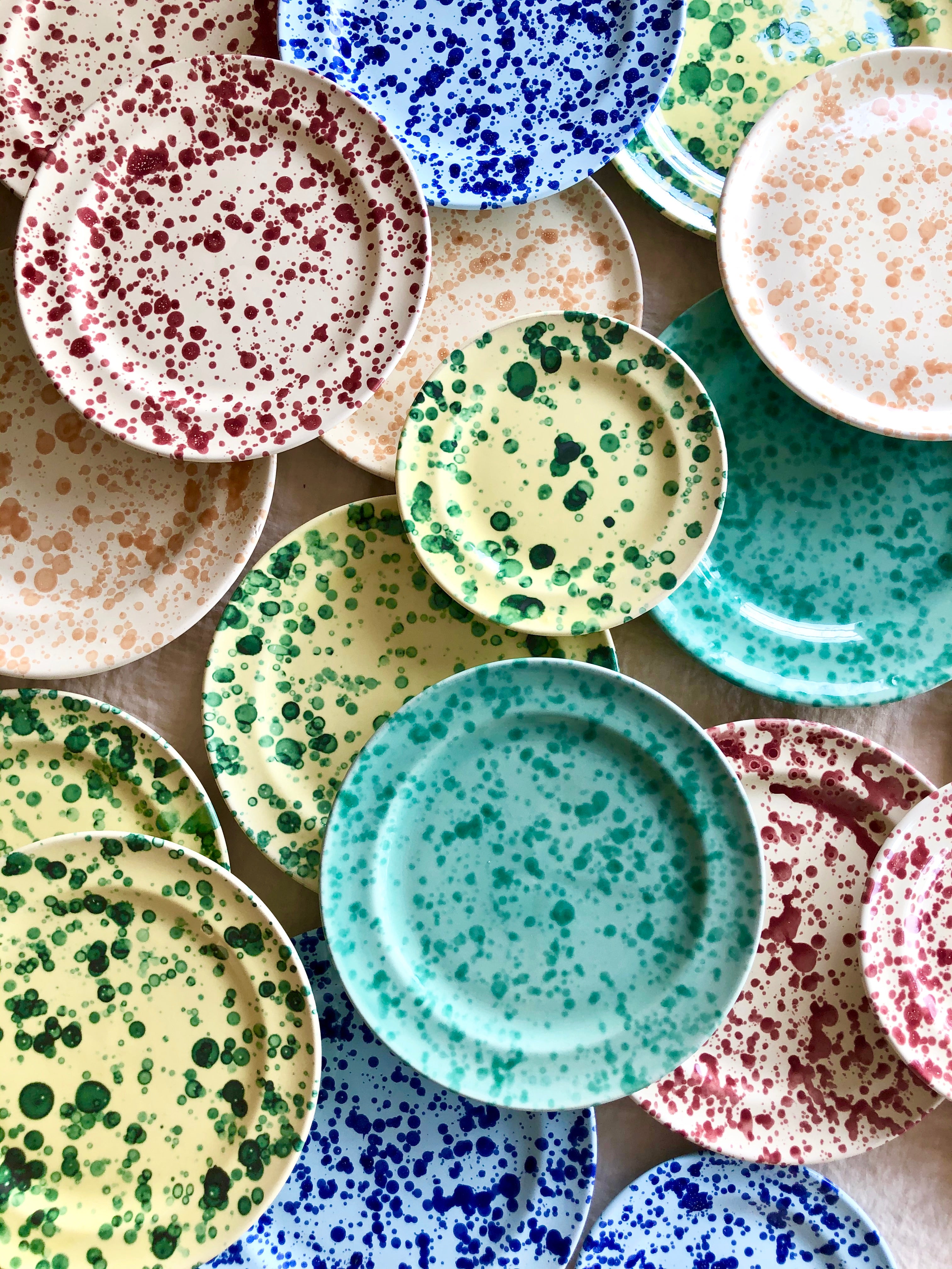cream fasano salad plate with light brown speckle pattern with other colors