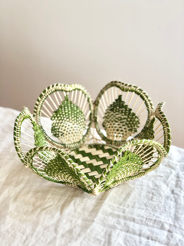 light brown and olive green round woven bread basket 8.5 inches in diameter