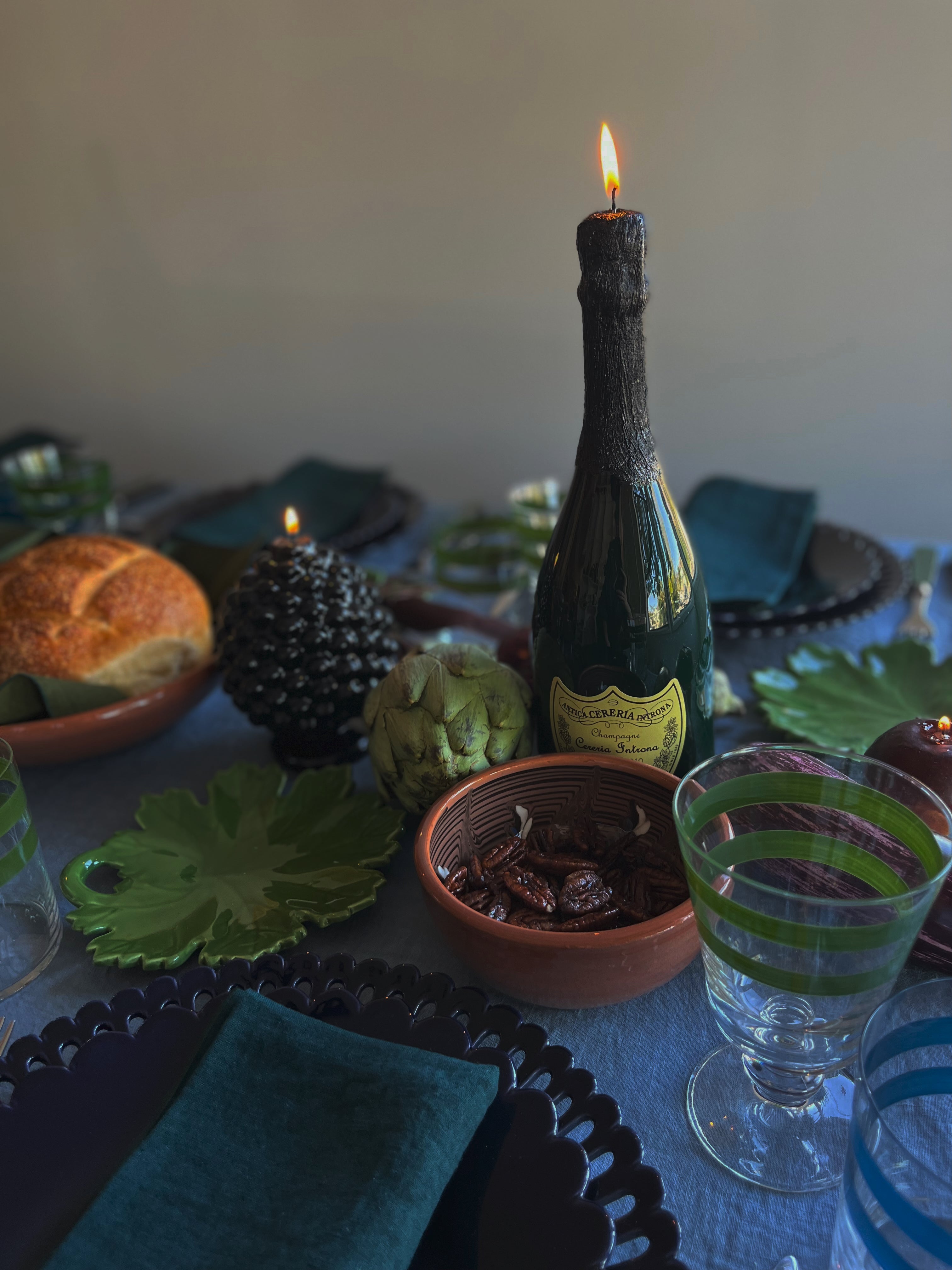 cereria introna paraffin champagne candle on table