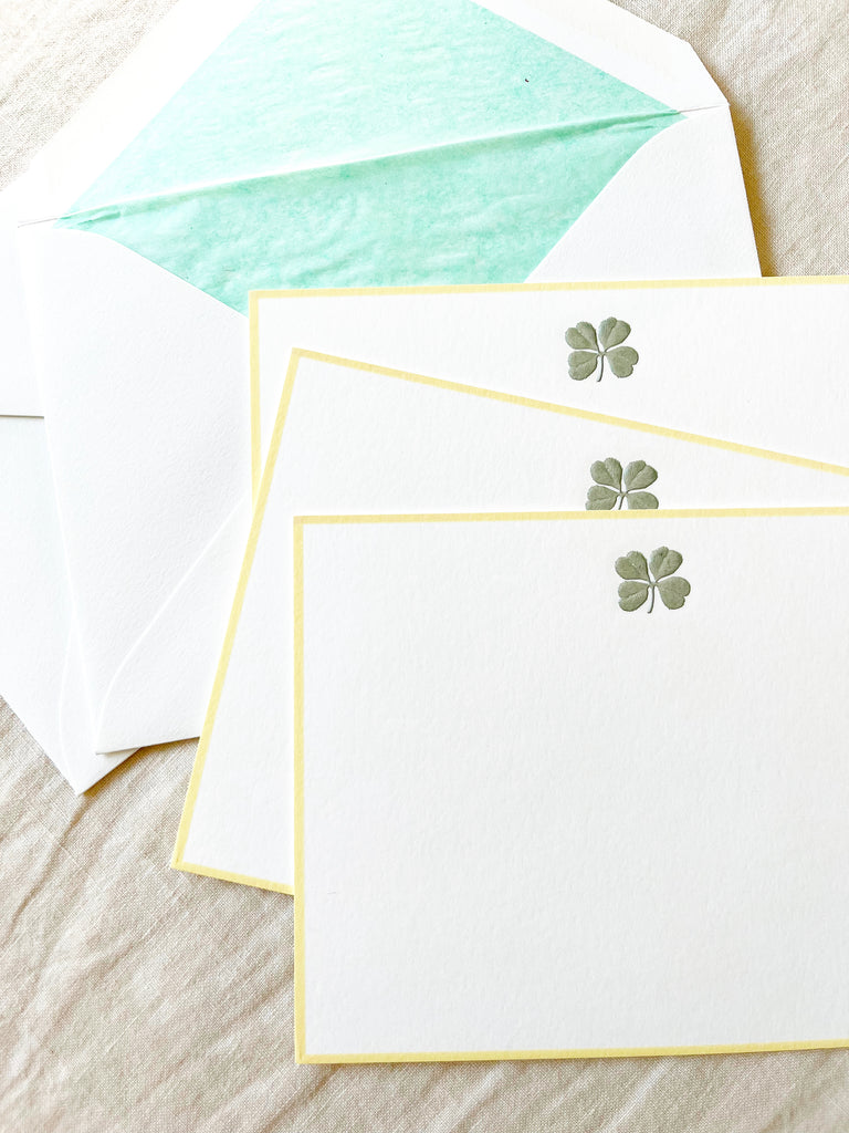 The Printery Four Leaf Clover Note Cards white with green four leaf clover and yellow edge 6.25 by 4.5 inches with green lined envelope