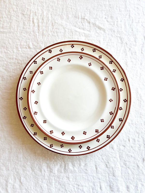 brown and white salad plate with matching dinner plate