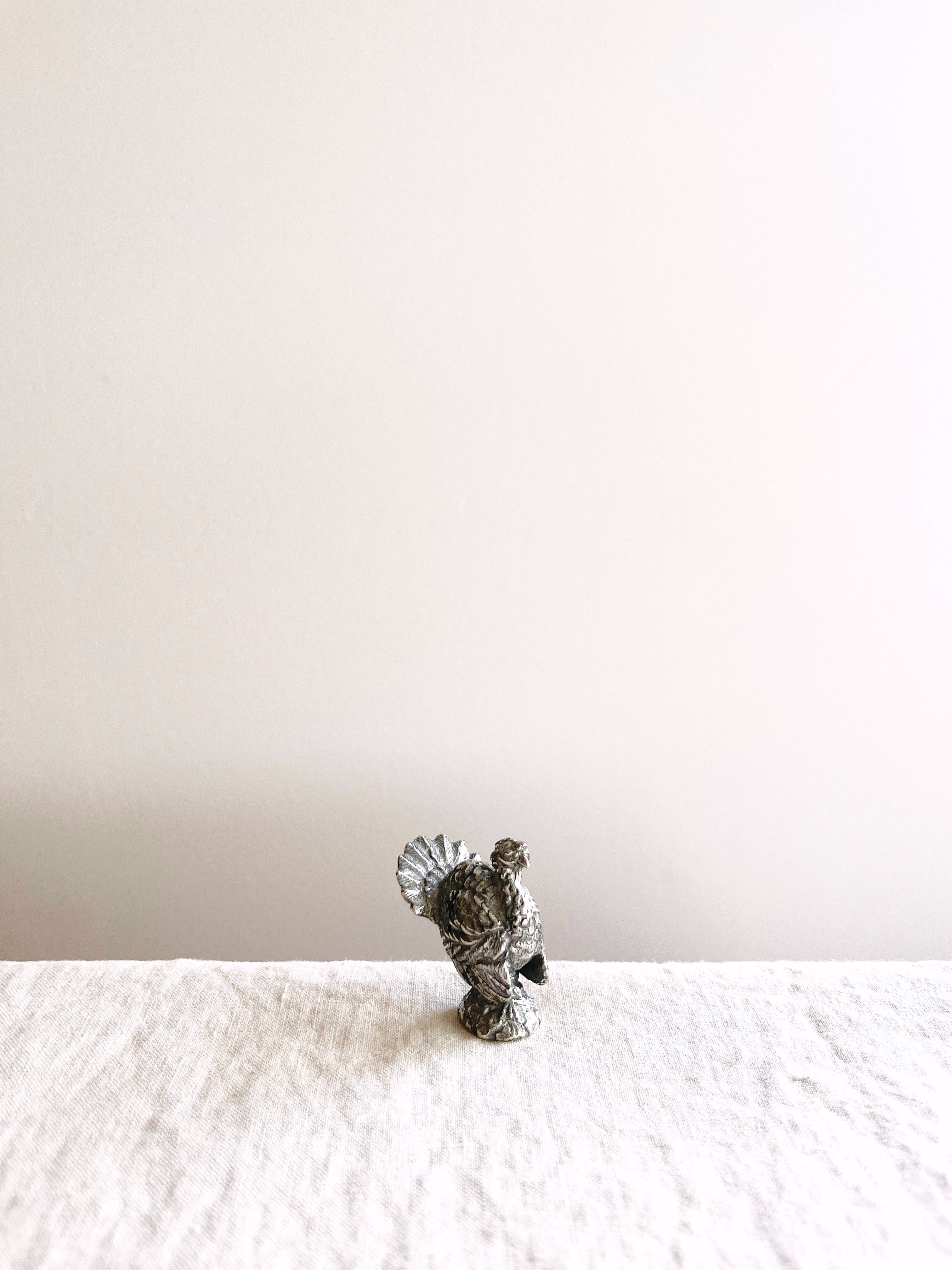 silver turkey place card holder angle view