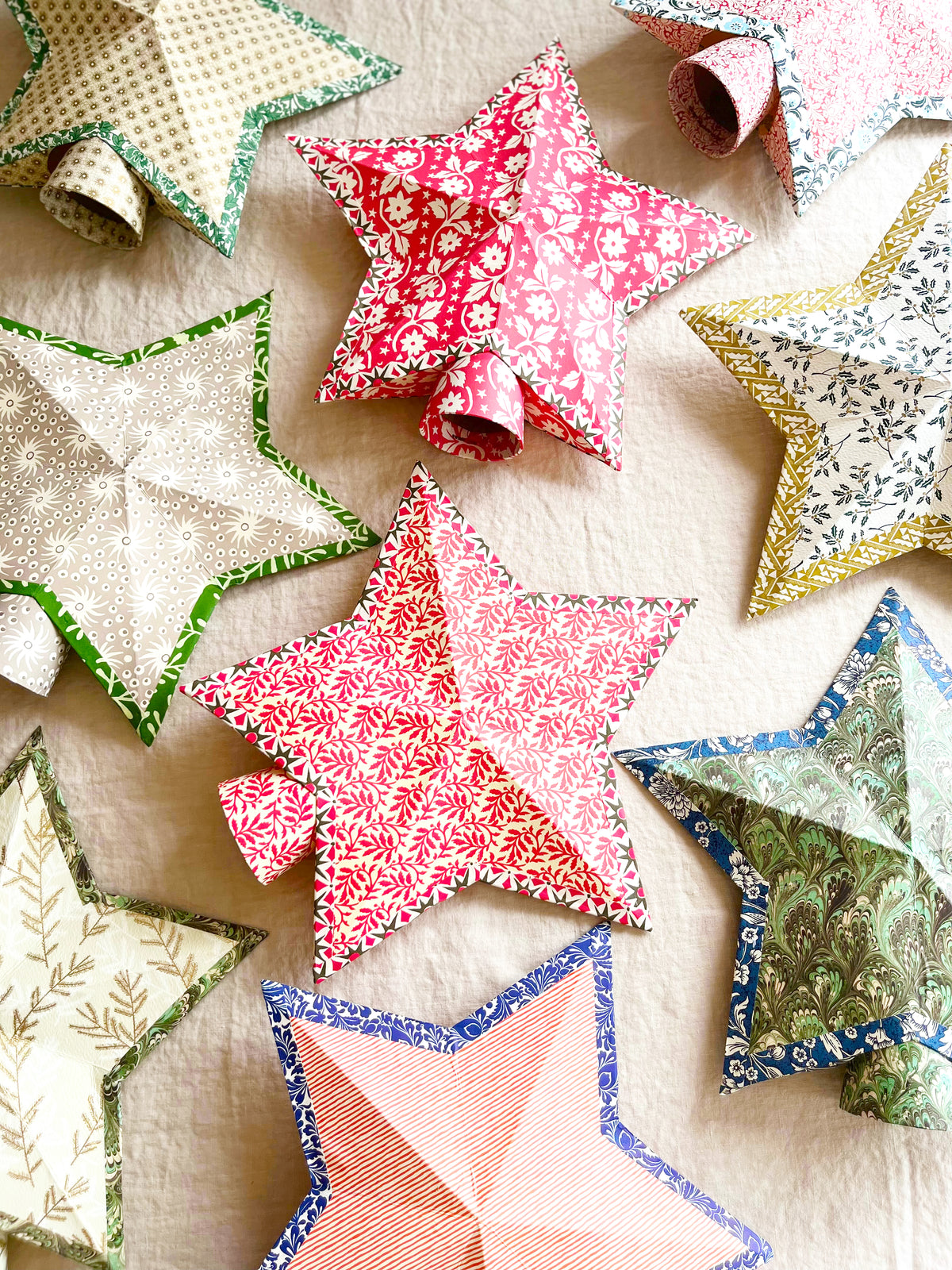 tree topper stars folk patterns red green