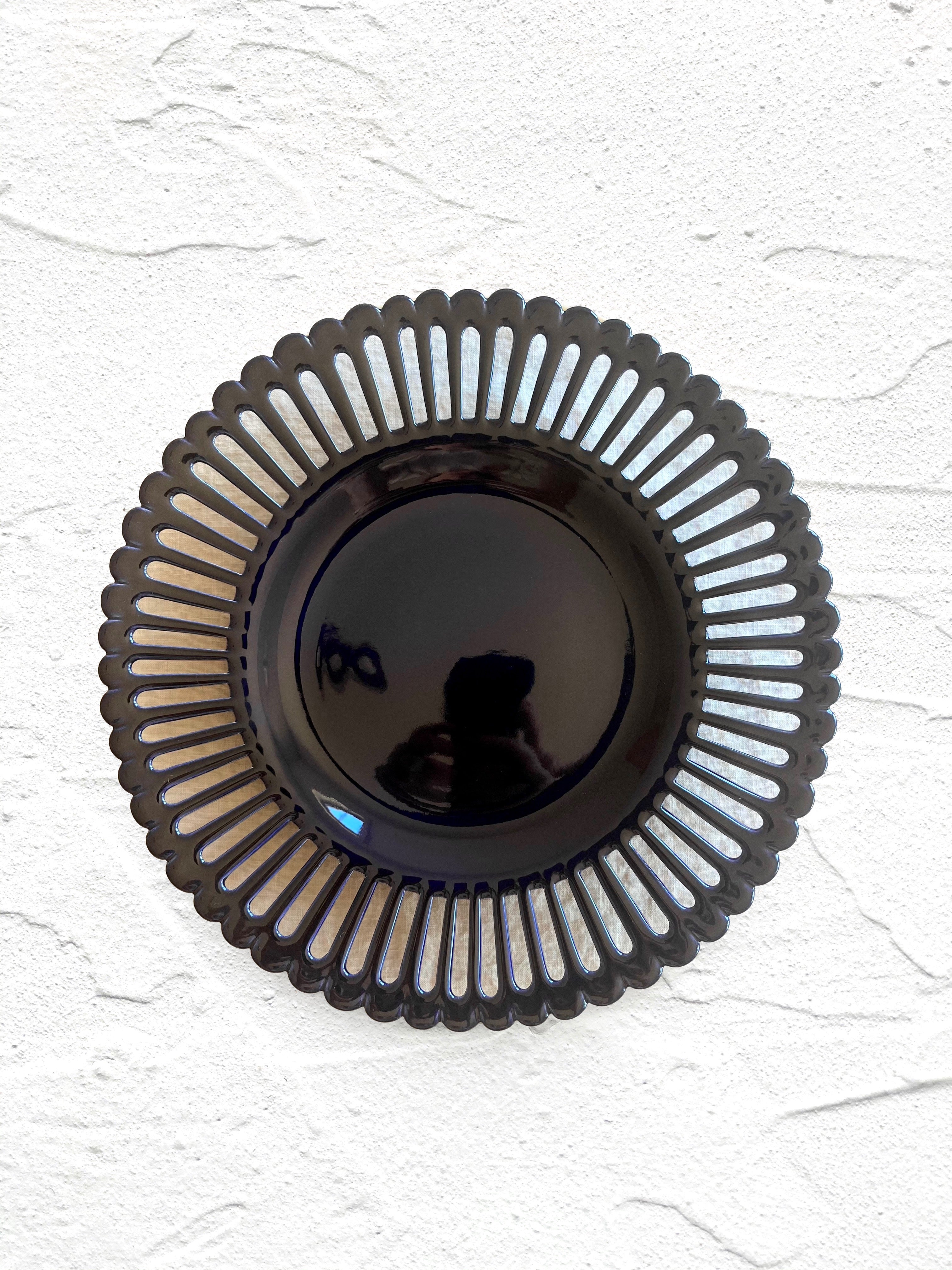 dark blue salad plate with openwork rim and scalloped edge