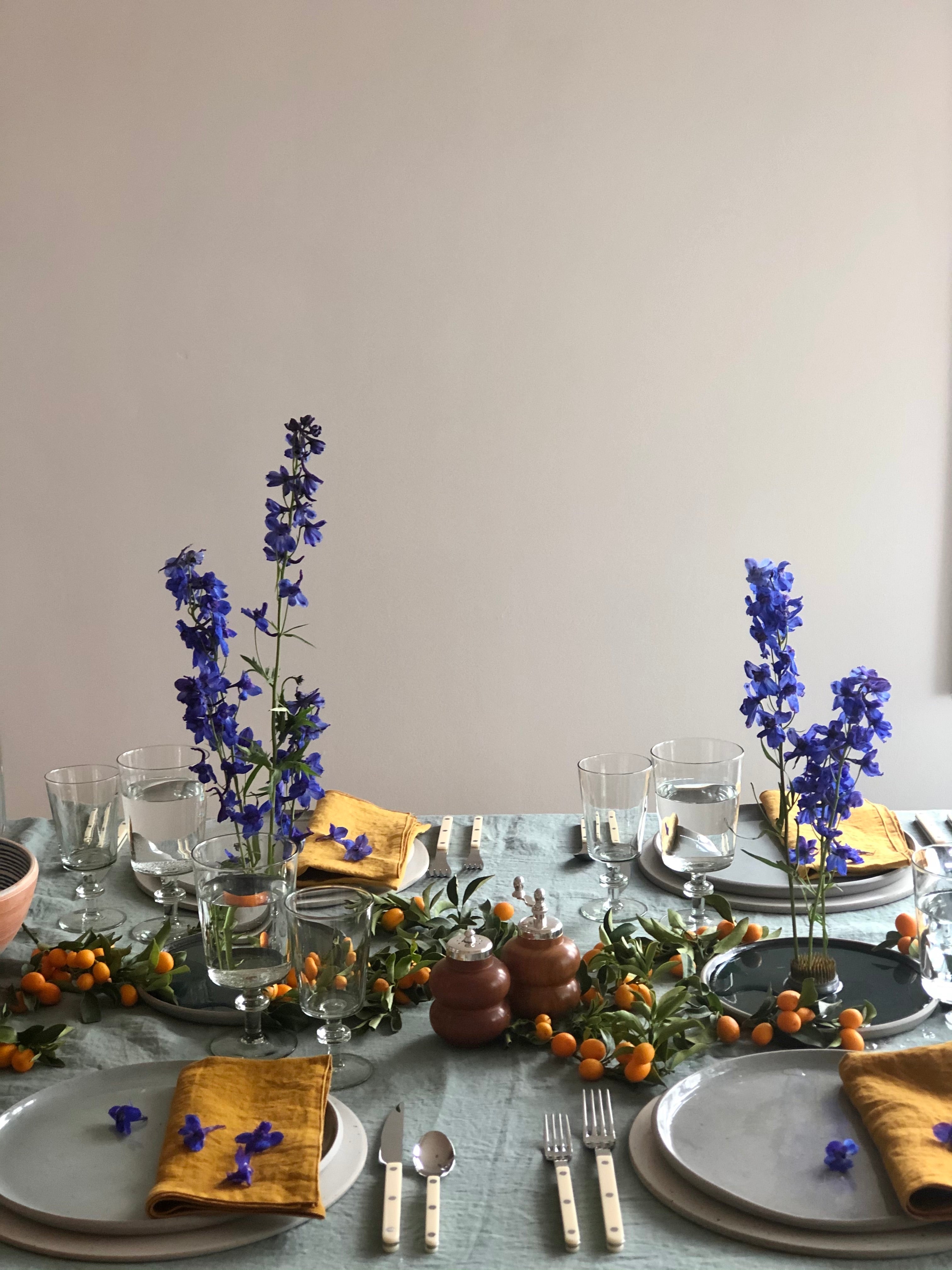 linen napkins 18 inch mustard color on table setting purple flowers