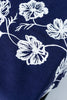 rectangular blue embroidered tablecloth with white flowers detail view