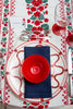 rectangular white embroidered tablecloth with red flowers with red dishes