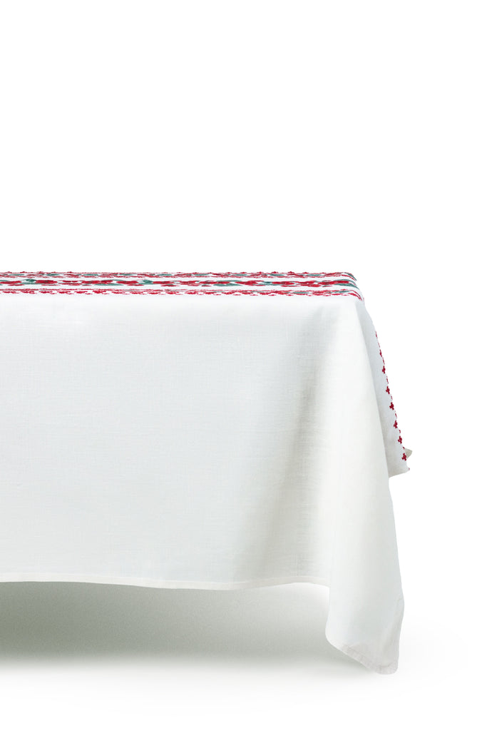 rectangular white embroidered tablecloth with red flowers side view
