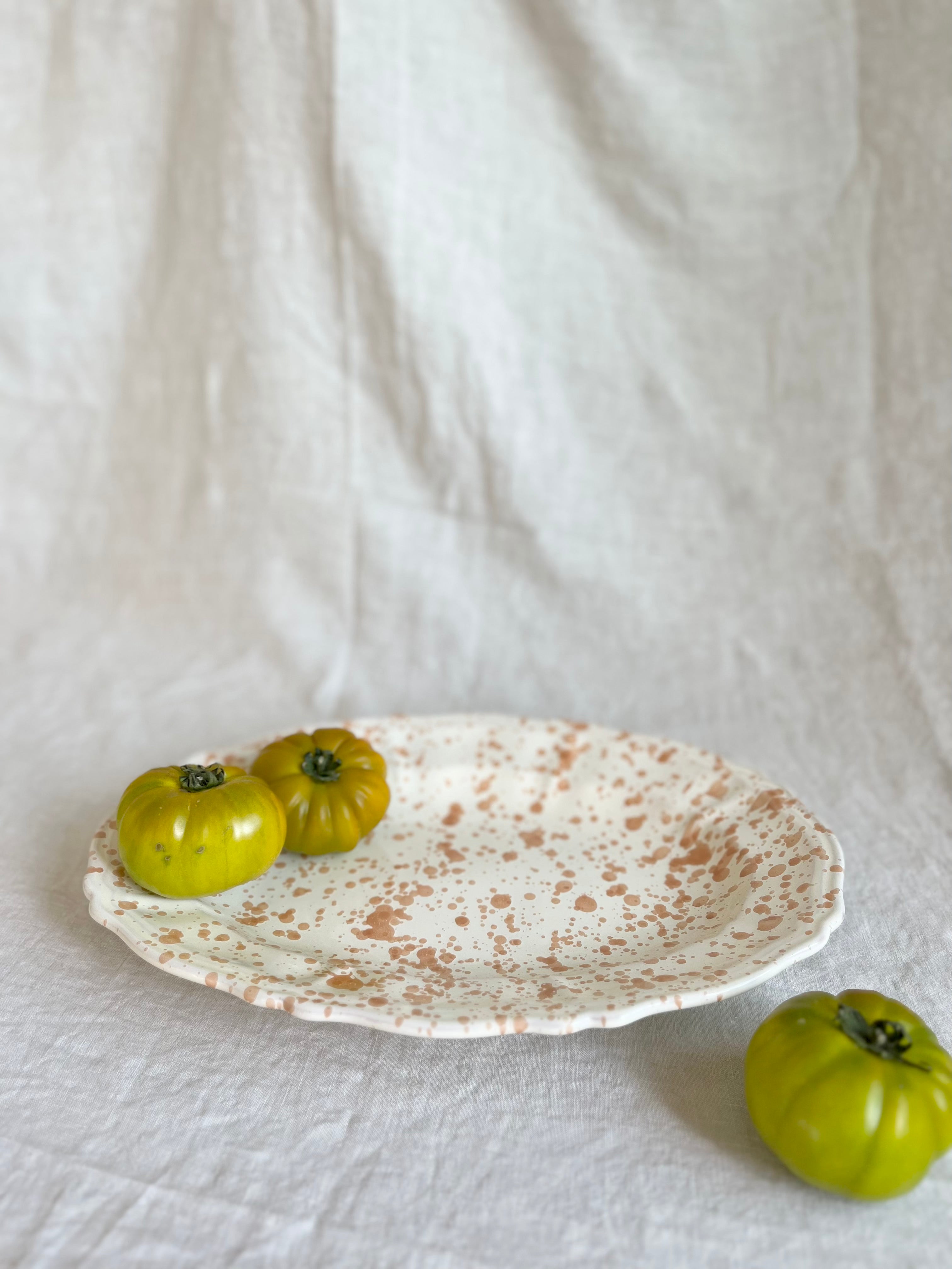 white and brown oval spatterware platter 14" side view