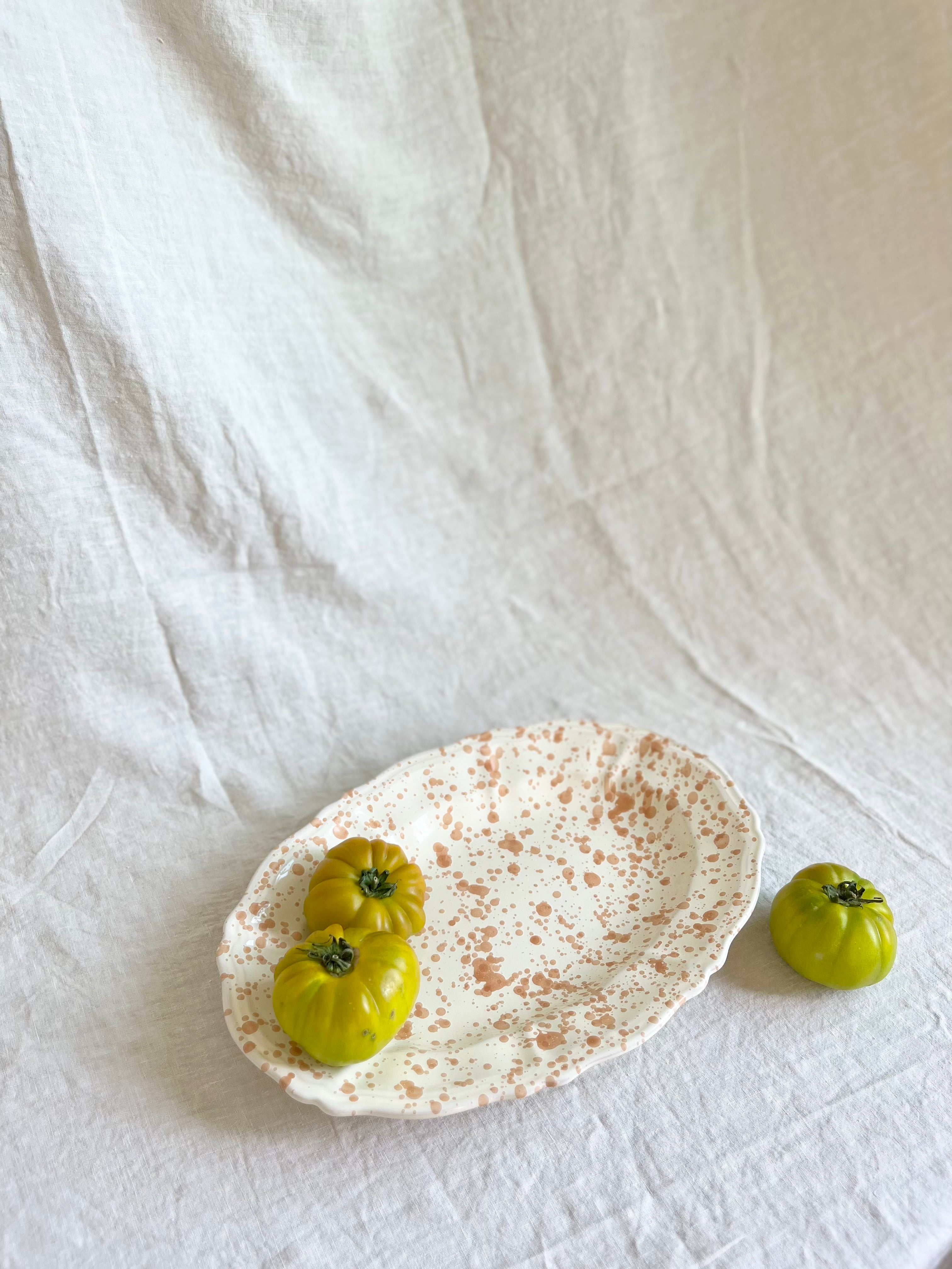 white and brown oval spatterware platter 14" with tomatoes