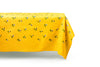 rectangular yellow tablecloth with white daisies distant view