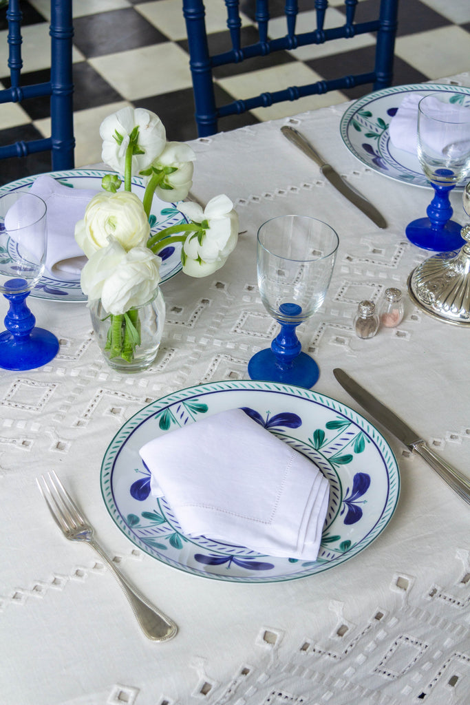 rectangular white eyelet tablecloth with tablesetting