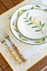 rectangular ivory and yellow embroidered placemat with china