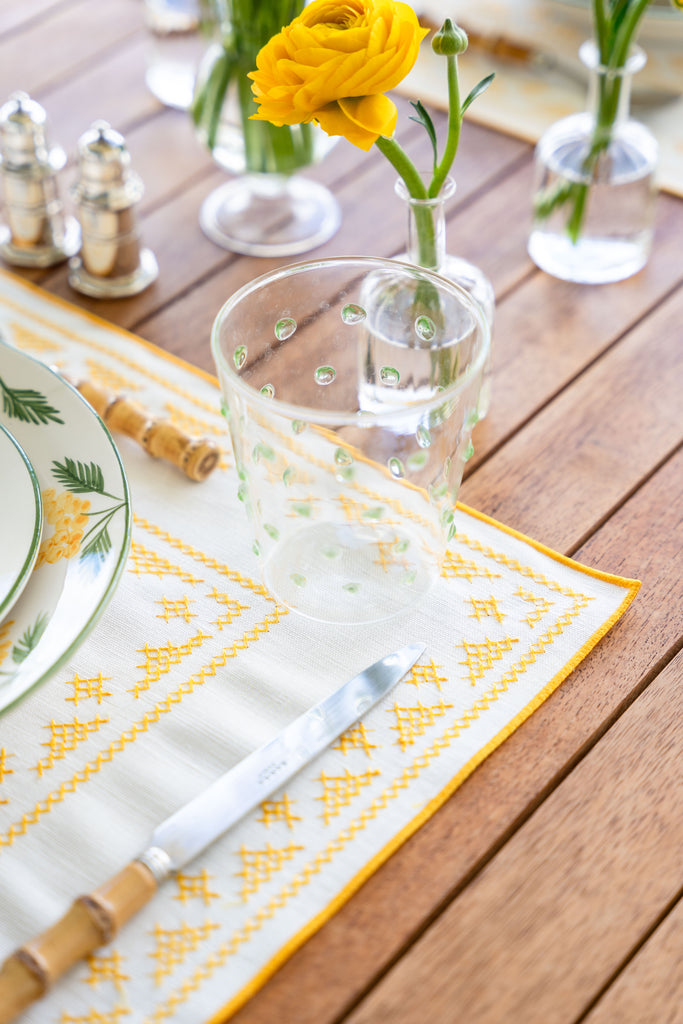 rectangular ivory and yellow embroidered placemat corner detail